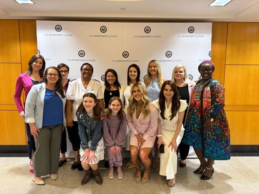 Large group photo at US State Department ceremony